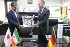 Ali Rasoolian, Deputy Minister at the Ministry of Industry, Mine and Trade of the Islamic Republic of Iran (on the left), and Hans-Udo Muzel, German Ambassador in Iran