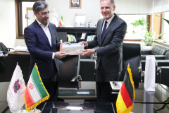 Ali Rasoolian, Deputy Minister at the Ministry of Industry, Mine and Trade of the Islamic Republic of Iran (on the left), and Hans-Udo Muzel, German Ambassador in Iran